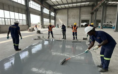 Floors GH team applying epoxy flooring in Ghana